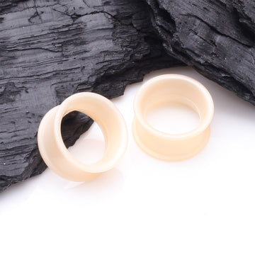 Detail View 1 of A Pair of Ultra Flexible Peach Silicone Double Flared Tunnel Plug